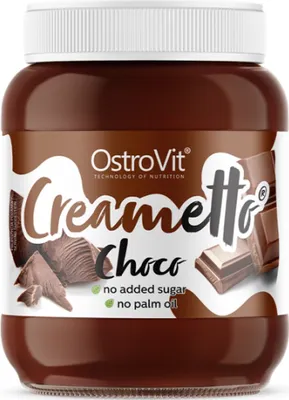 A jar of chocolate spread with chocolate pieces on a white background.