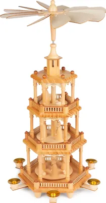 A wooden Christmas pyramid with multiple tiers and candle holders.