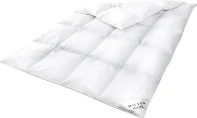 A white down comforter is shown laid out flat on a white background.