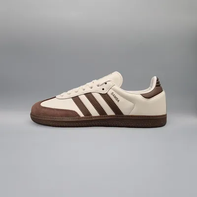 A side view of an Adidas Samba OG sneaker.