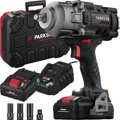 A cordless impact wrench set with accessories, including batteries, a charger, and a carrying case, displayed against a white background.