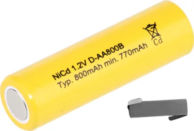 A single yellow battery with text and symbols printed on it, and a small gray accessory next to it.