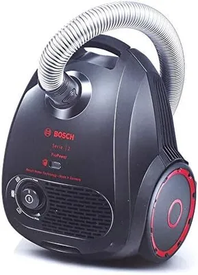 A black Bosch Serie 2 vacuum cleaner with red accents and a silver hose is shown against a white background.
