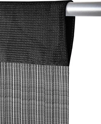 A close-up of a black curtain with vertical stripes hanging from a silver curtain rod.