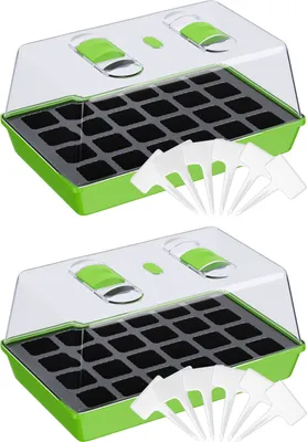 Two identical seed starter trays with clear lids and ventilation controls, along with several plant markers, are displayed against a white background.