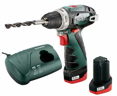 A cordless drill, its charger, and a spare battery are displayed against a white background.