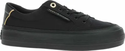 A black Tommy Hilfiger platform sneaker is shown from the side against a white background.