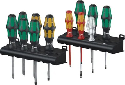 Two black tool racks holding sets of screwdrivers.
