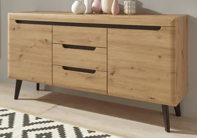 A wooden sideboard with black legs and drawer handles, decorated with vases on top.
