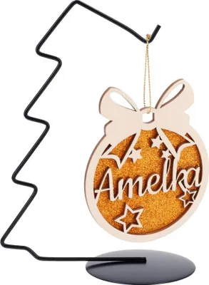 A Christmas ornament with the name 'Amelka' on a stand.