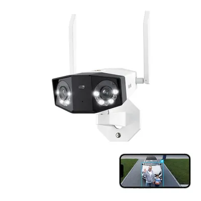 A dual-lens security camera with spotlights and antennas, shown with a smartphone displaying a live feed of a person and a car.