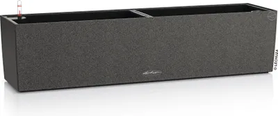 A long, rectangular planter box with a textured gray exterior and a black interior. A small red and white water level indicator is visible in the top left corner.