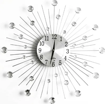 A modern wall clock with a sunburst design and crystal accents, displayed against a white background.