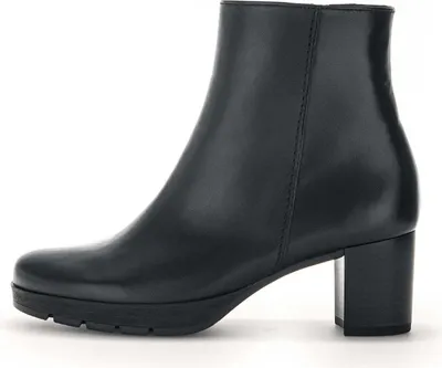 A black leather ankle boot with a block heel is shown from the side against a white background.