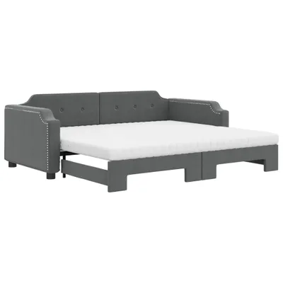A dark gray fabric daybed with a white mattress is shown against a white background.
