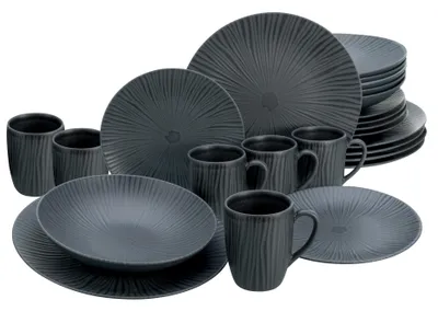 A collection of dark gray stoneware dishes and mugs arranged on a white background.