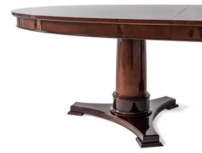 Image de Élégante table à manger ovale avec plateaux et colonnes extensibles