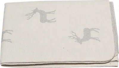 A folded blanket with a deer pattern.