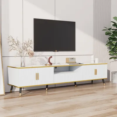 A modern living room with a TV stand and a television.