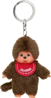 A Monchhichi keychain with a red bib.