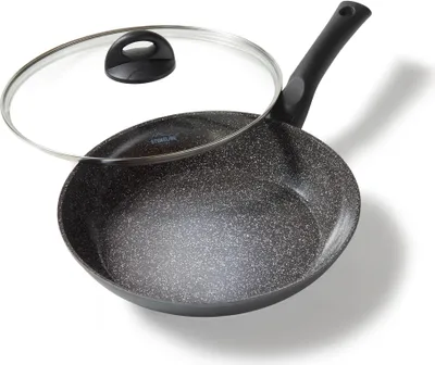 A frying pan with a lid, shown from a slightly elevated angle on a white background.