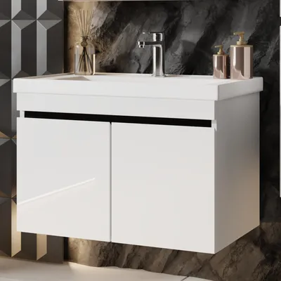 A white vanity sink with a chrome faucet and two doors, set against a dark, textured wall.