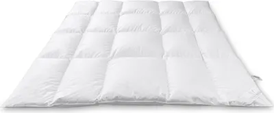 A white down comforter is laid out flat on a white background.