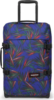 A blue suitcase with a tropical leaf pattern and black accents.