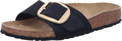 A single black Birkenstock sandal with a large gold buckle is shown from a side-diagonal view against a white background.