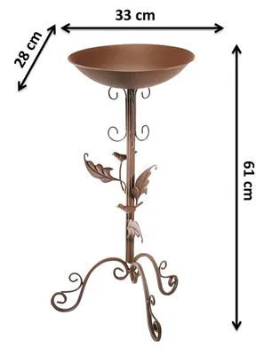 A decorative metal bird bath with a stand, featuring leaf and bird motifs. Dimensions are indicated with measurement lines and text.