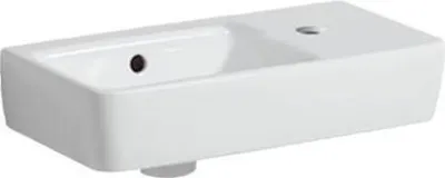 A white ceramic sink with a rectangular basin and a flat top surface.