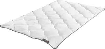 A white comforter with a diamond-stitched pattern and gray trim is laid out on a white background.