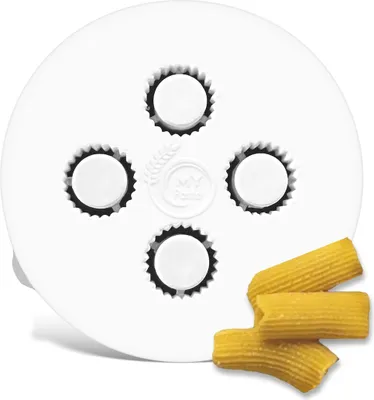 A white pasta maker disc with four openings and three pieces of rigatoni pasta.