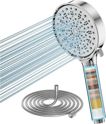 A shower head with water spraying out, and a coiled shower hose on a white background.