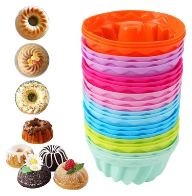 A collection of colorful silicone mini bundt cake molds and several decorated mini bundt cakes.