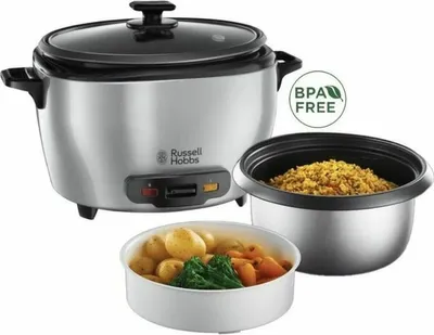 A Russell Hobbs rice cooker with a glass lid, shown with a separate inner pot filled with rice and a bowl containing cooked vegetables and potatoes.