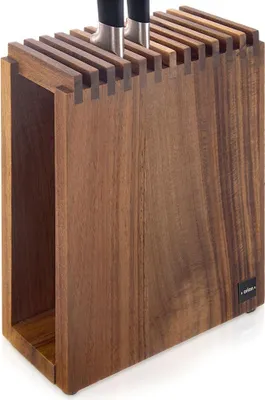 A wooden knife block with knives inserted.