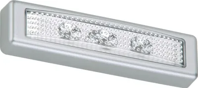 A silver LED push light with a clear lens, showing three individual LED lights.