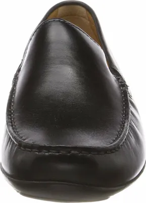 A close-up, front-facing view of a black leather loafer.