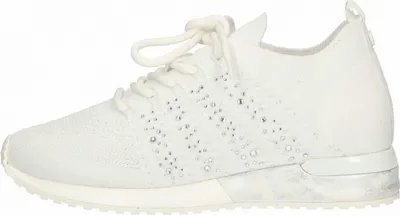 A side view of a white sneaker with rhinestones.