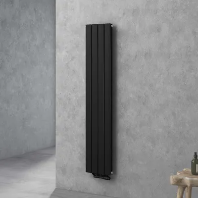 A black vertical radiator mounted on a textured gray concrete wall in a modern bathroom setting.