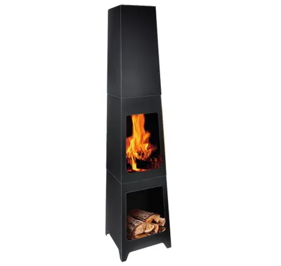 A tall, black, modern outdoor fireplace with a glass window showing flames and a lower compartment with firewood.