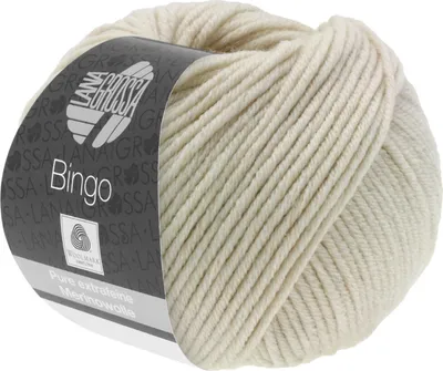 A ball of cream-colored yarn with a label.