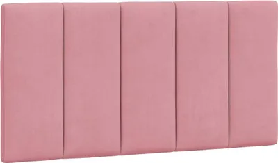 A pink upholstered headboard with vertical stitching.