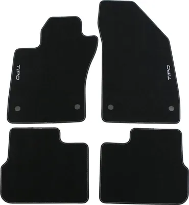 Four black car floor mats arranged on a white background.