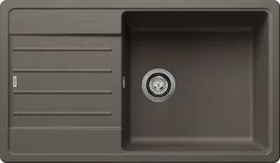 A top-down view of a kitchen sink with a drainboard.