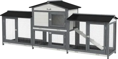 A three-section wooden hutch for small animals, with two side runs and a central enclosed area, featuring ramps and mesh doors.