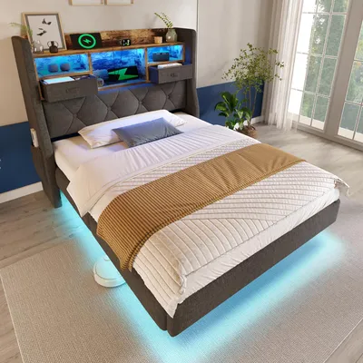 A modern bedroom with a bed featuring integrated LED lighting and a charging station.