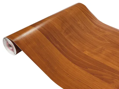 A roll of wood-grain contact paper on a white background.