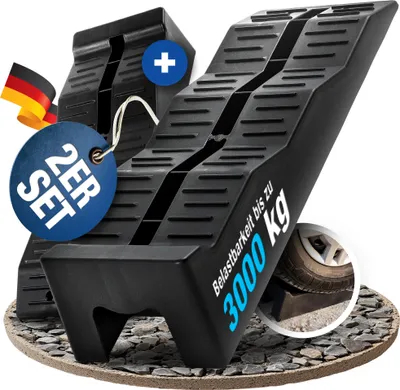 Two black leveling ramps for vehicles, with a German flag and product information labels.